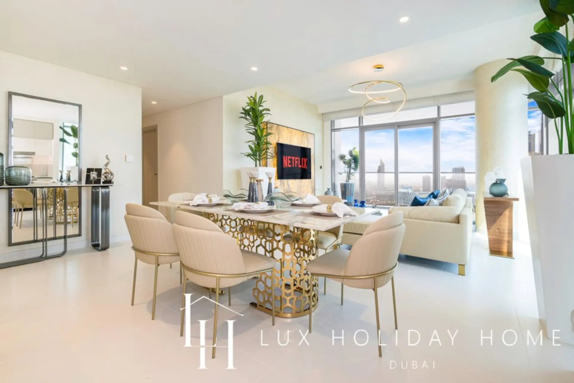 Elegant dining and living area at LUX Marina Vista Beachfront Suite 3, Dubai