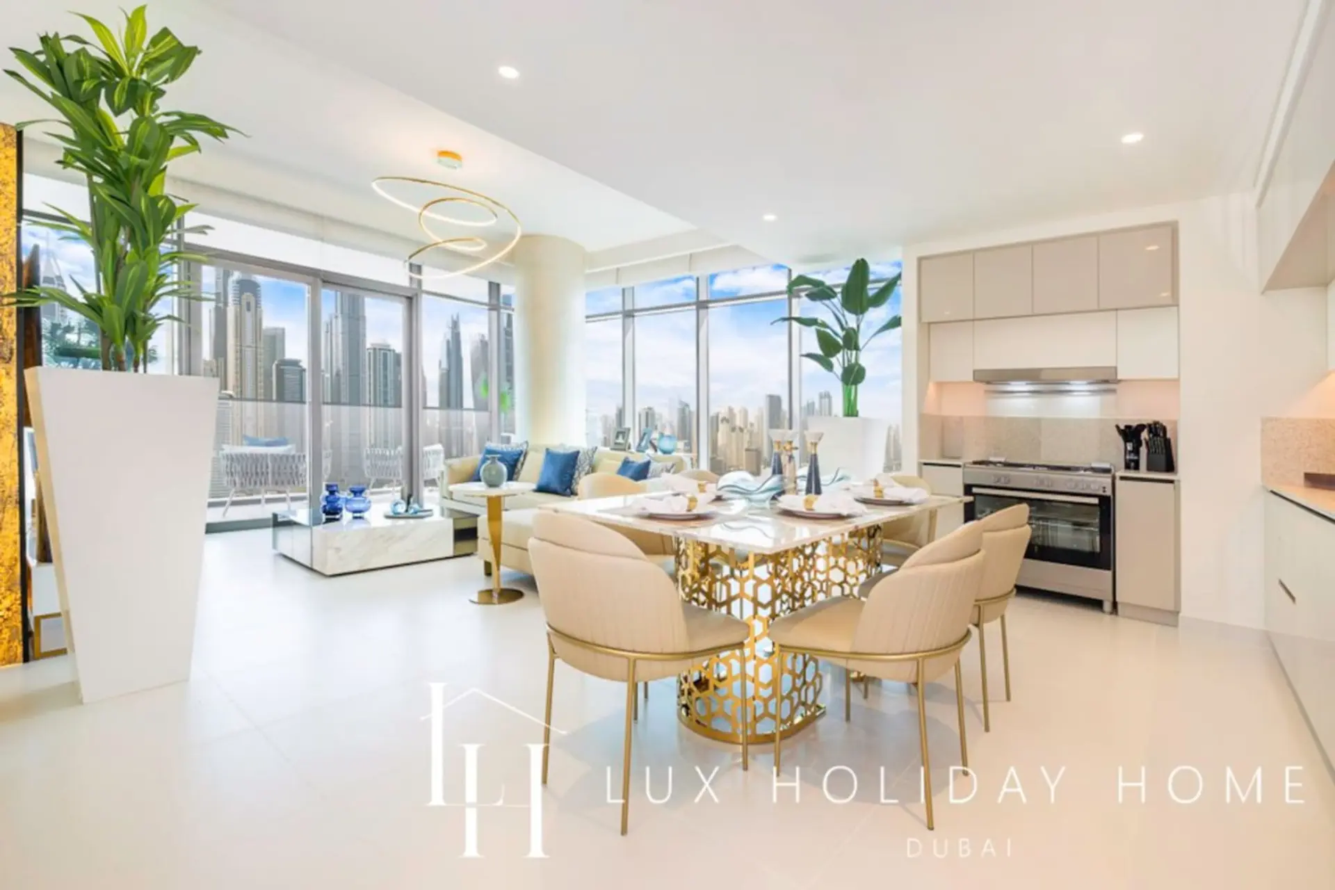 Open kitchen and dining area overlooking the Dubai skyline at LUX Marina Vista Beachfront Suite 3