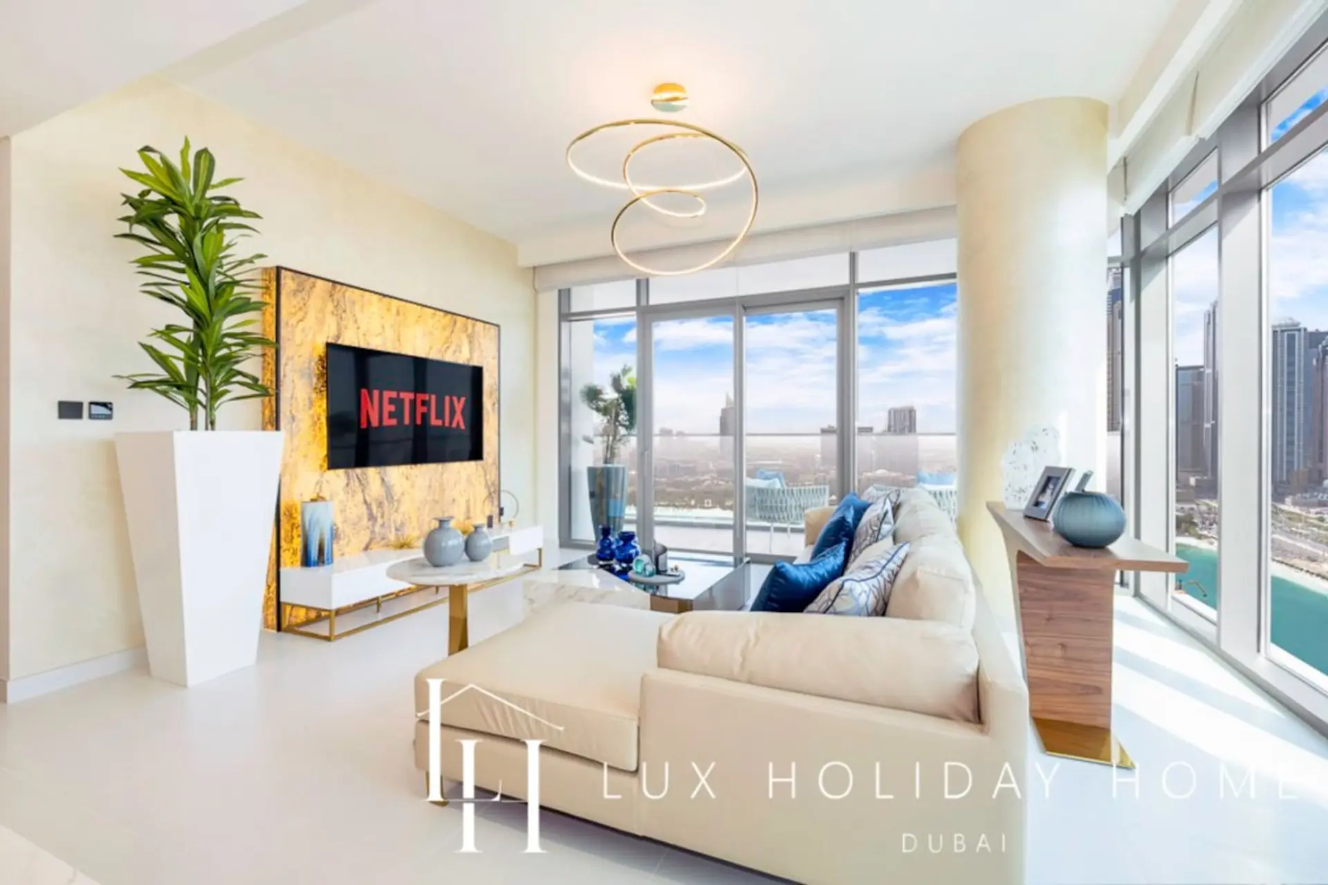 Living room with Marina skyline views at LUX Marina Vista Beachfront Suite 3, Dubai