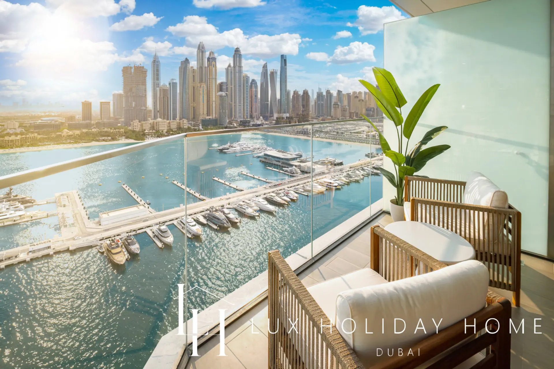 Balcony seating overlooking the marina at the Palace Residence Suite 2, Dubai