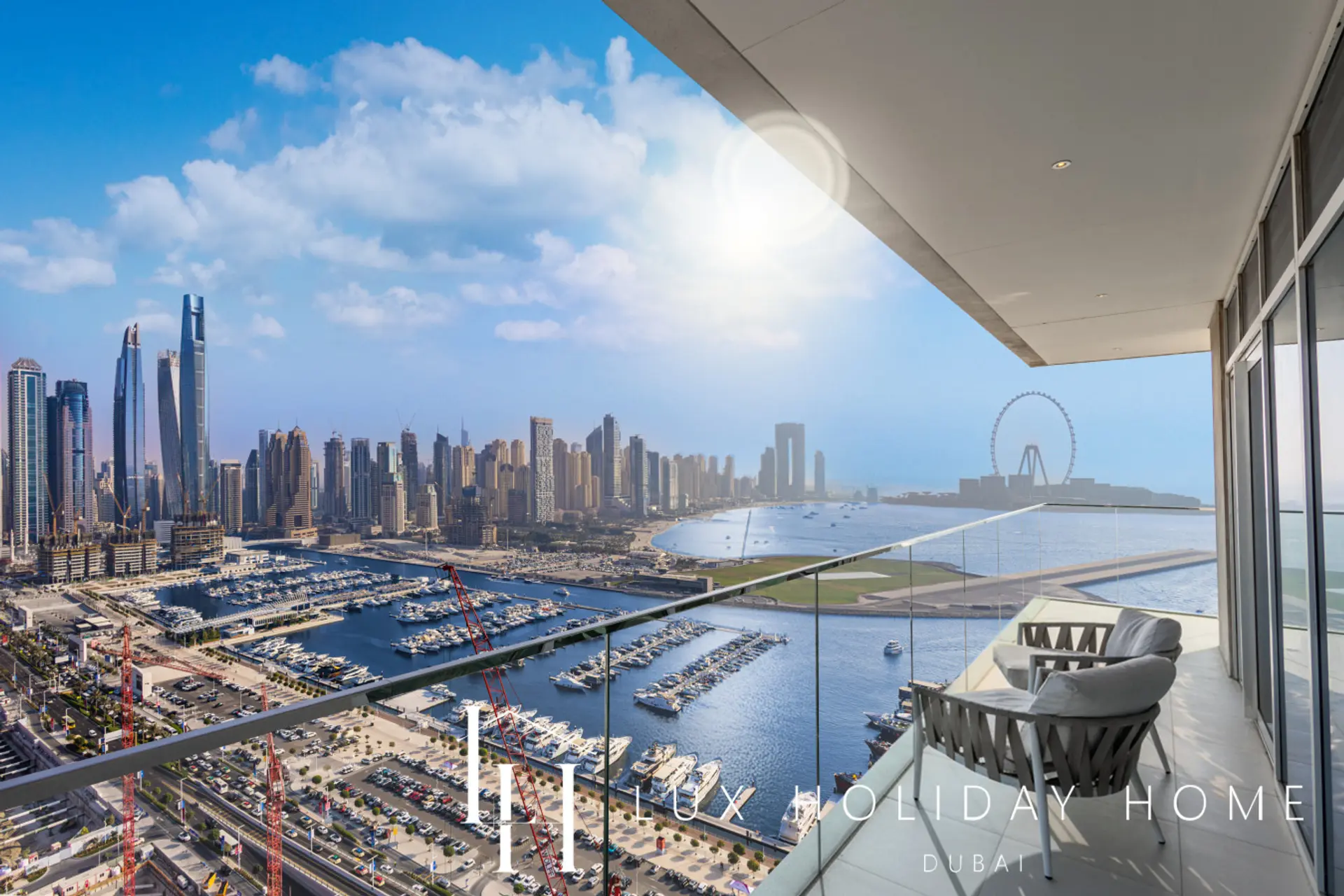 Panoramic balcony view of Dubai Marina and the Dubai Eye from the Palm Sea Skyline Penthouse