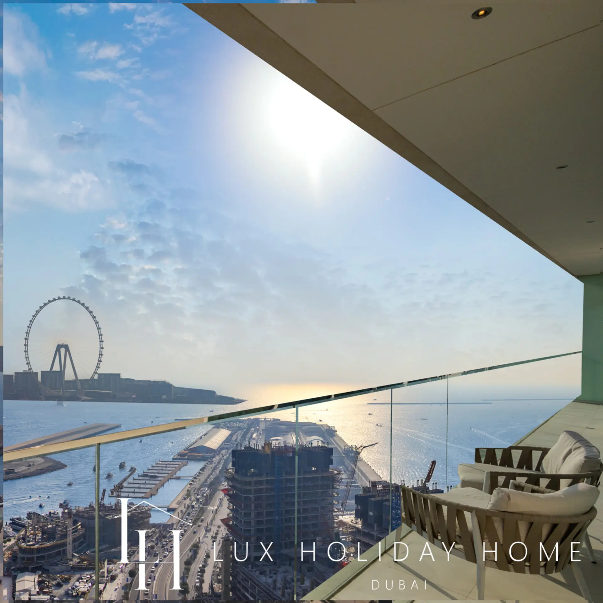 Terrace seating overlooking the Dubai Eye and the harbour at the Palm Sea Skyline Penthouse